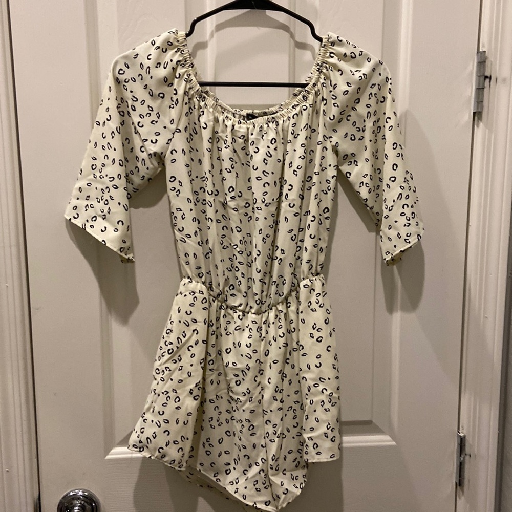 Cream and Black Junior Size small 100% polyester romper